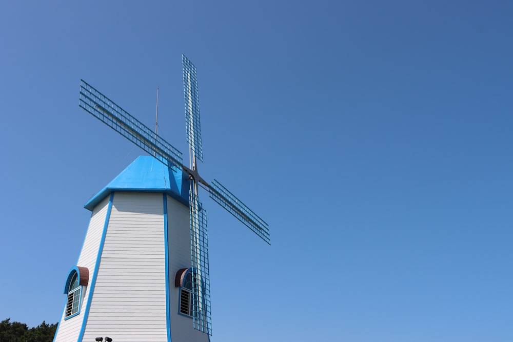 a windmill with a blue sky