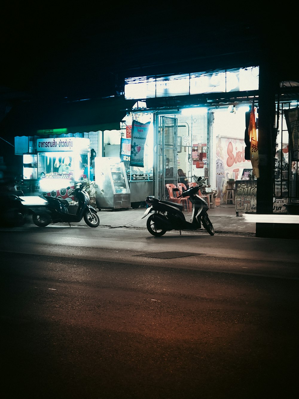 a couple of motorcycles parked outside a building