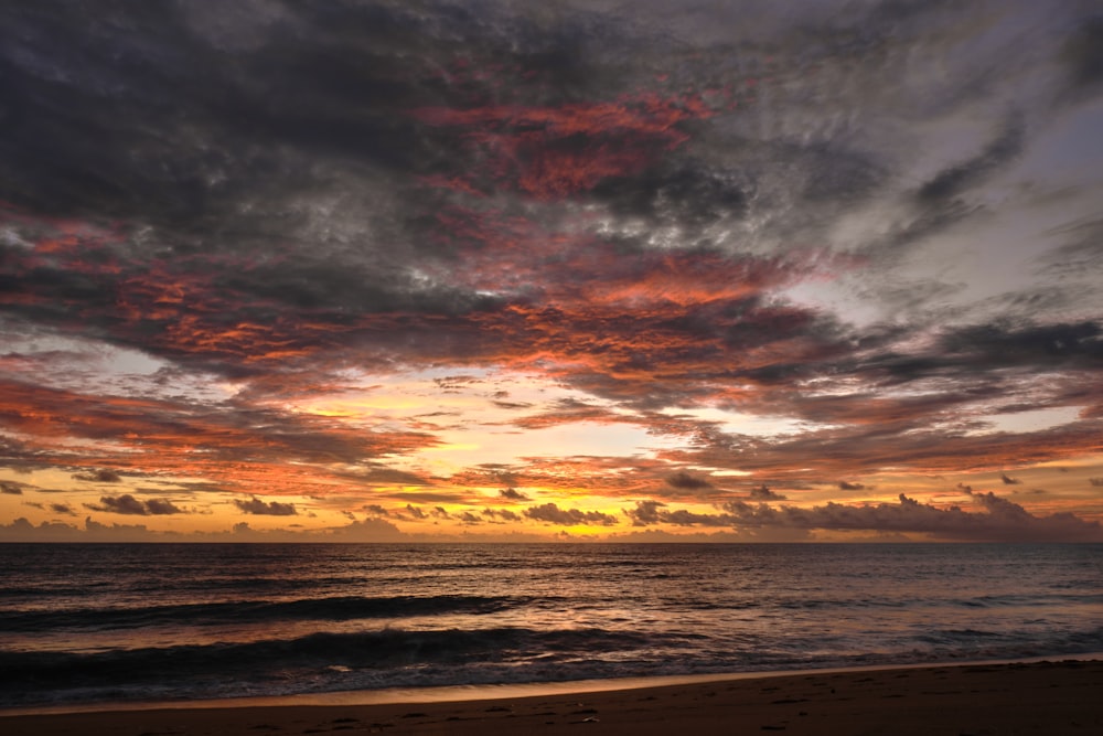 a beach with a sunset