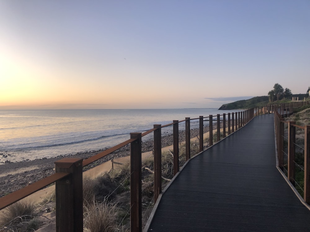 a wooden walkway to a beach