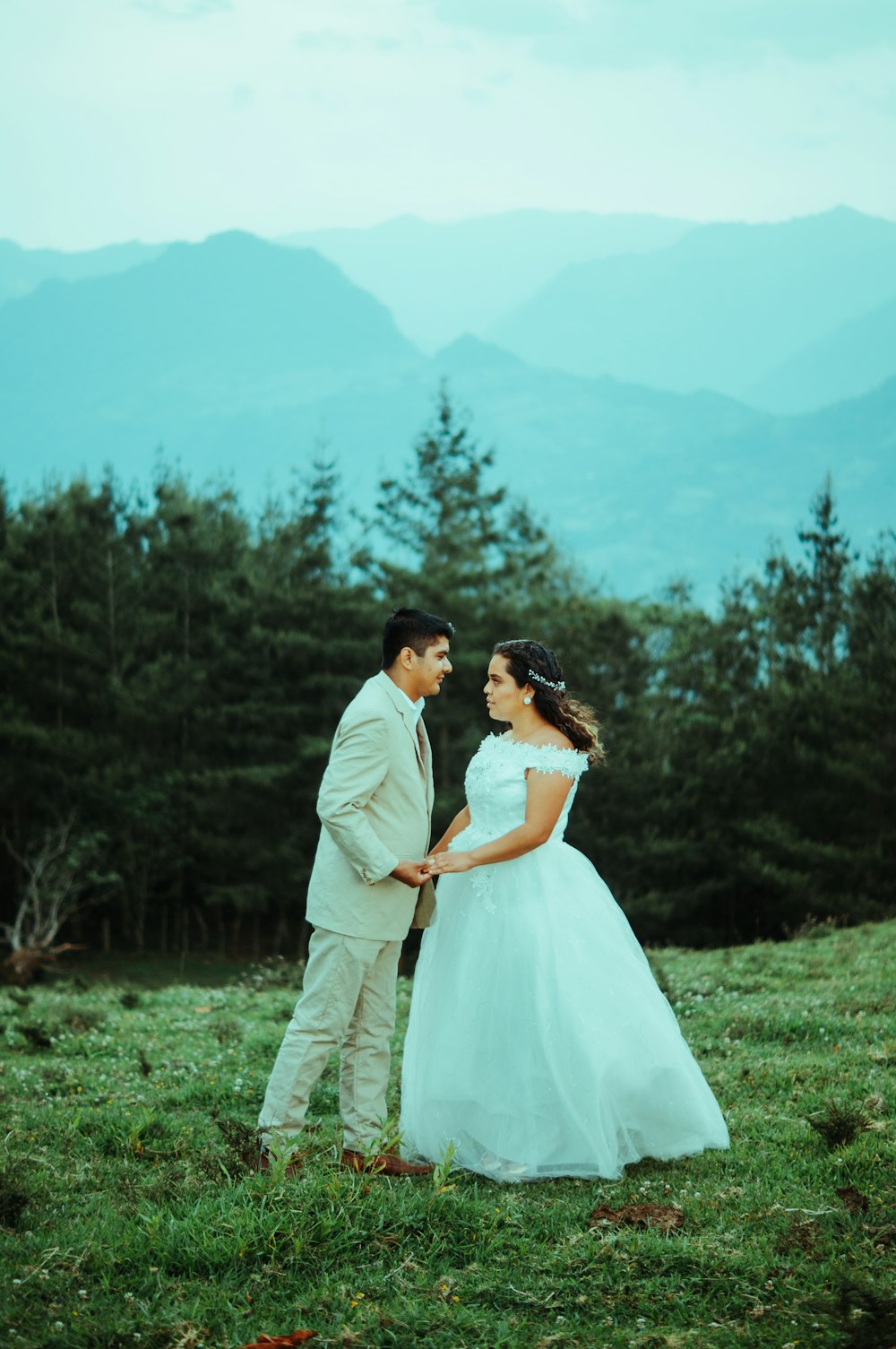 a man and woman in wedding attire