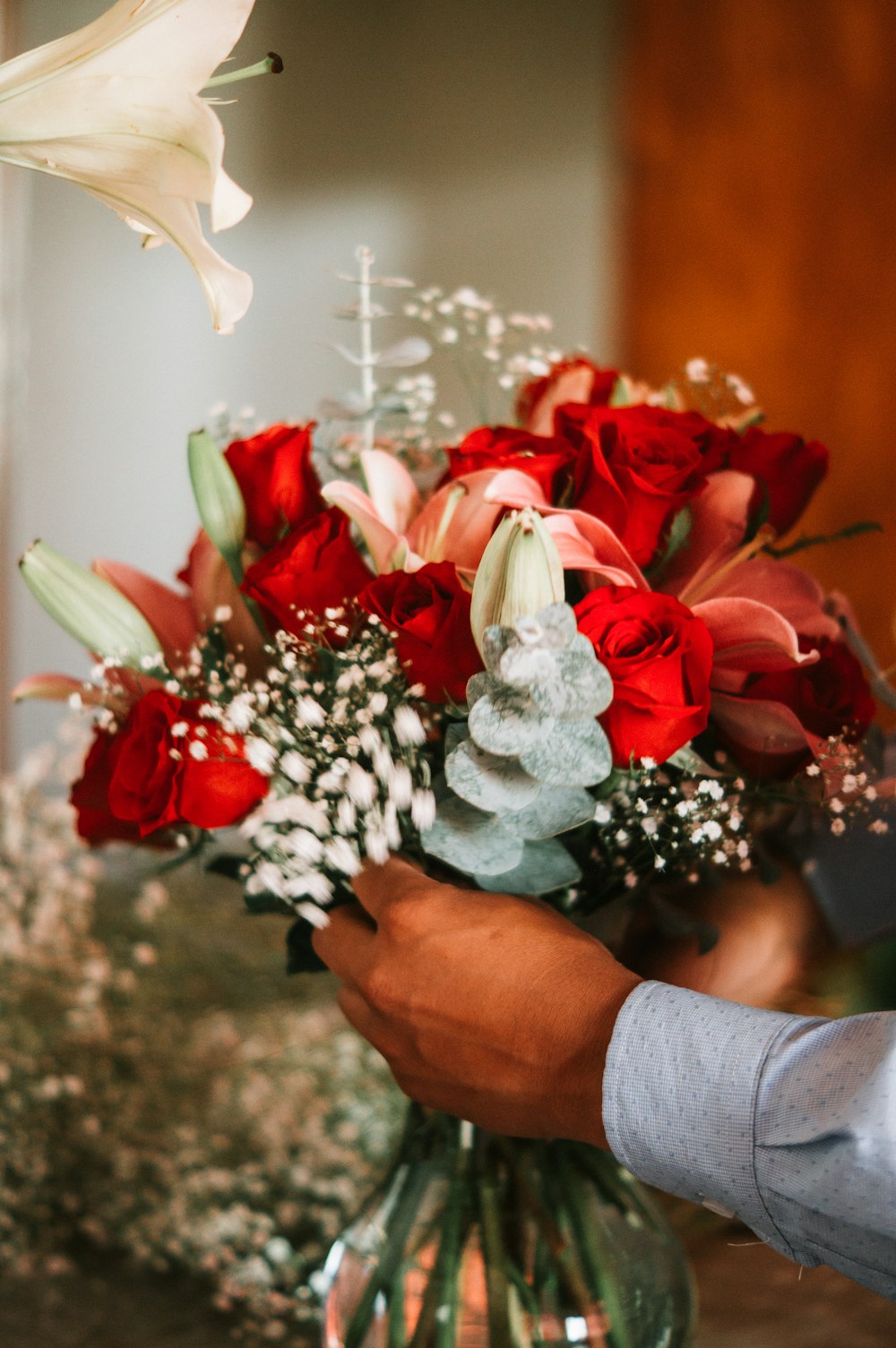 a bouquet of red and white flowers