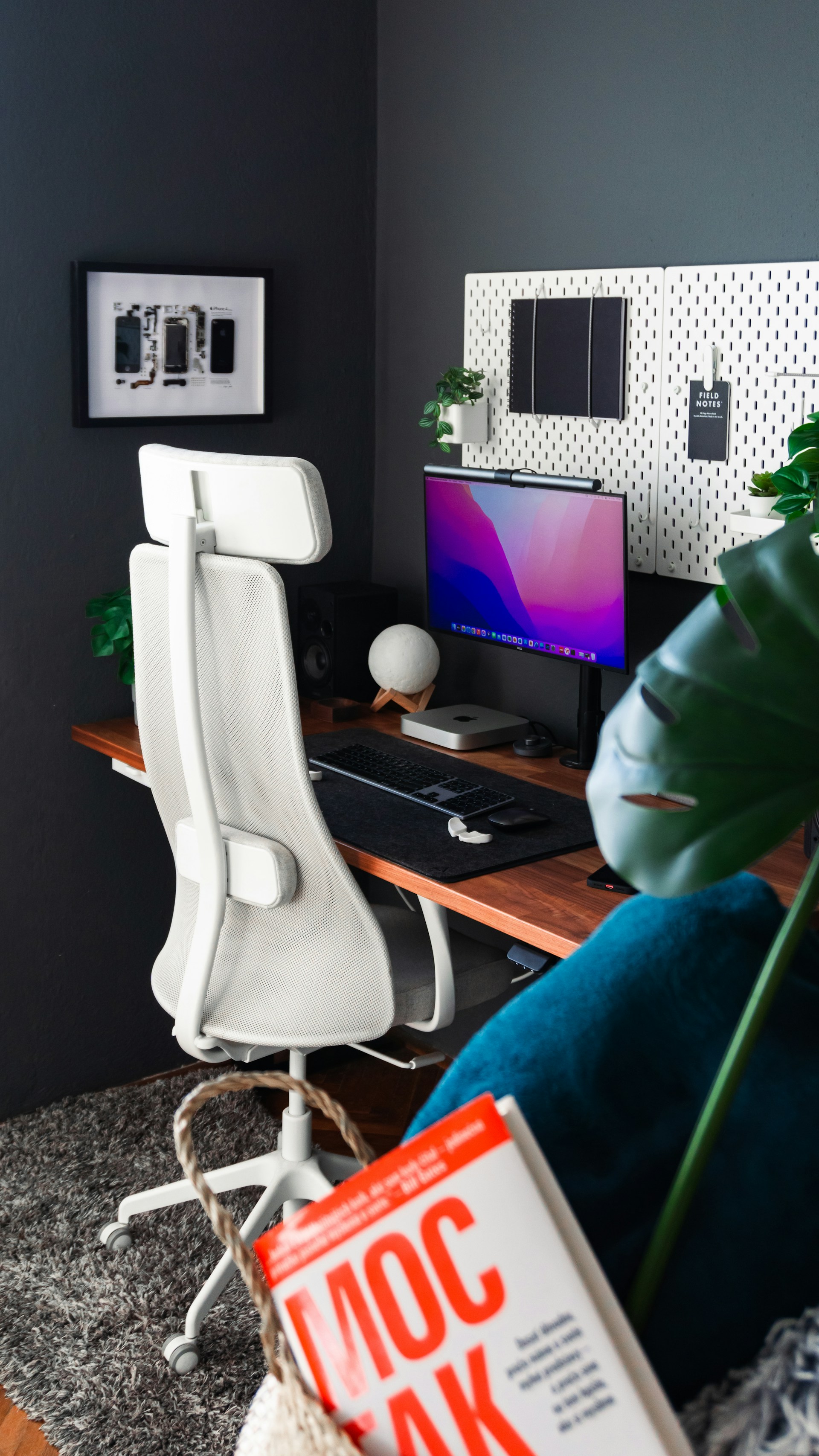 a desk with a computer and a chair in front of it