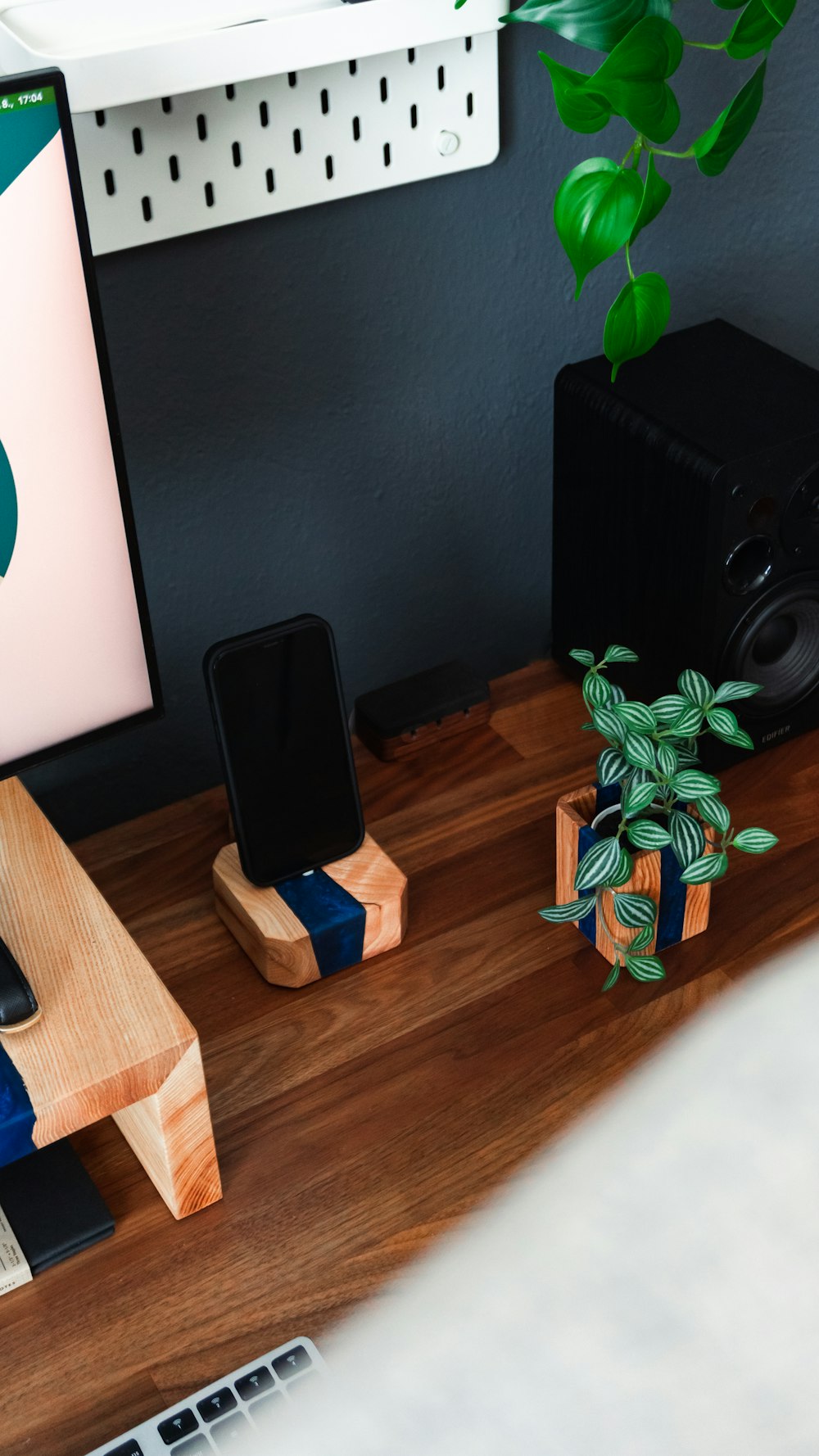 a desk with a computer and speakers