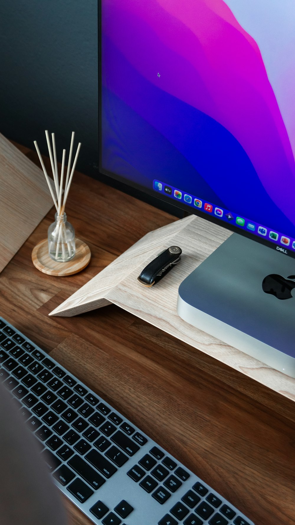 a desk with a computer and a keyboard