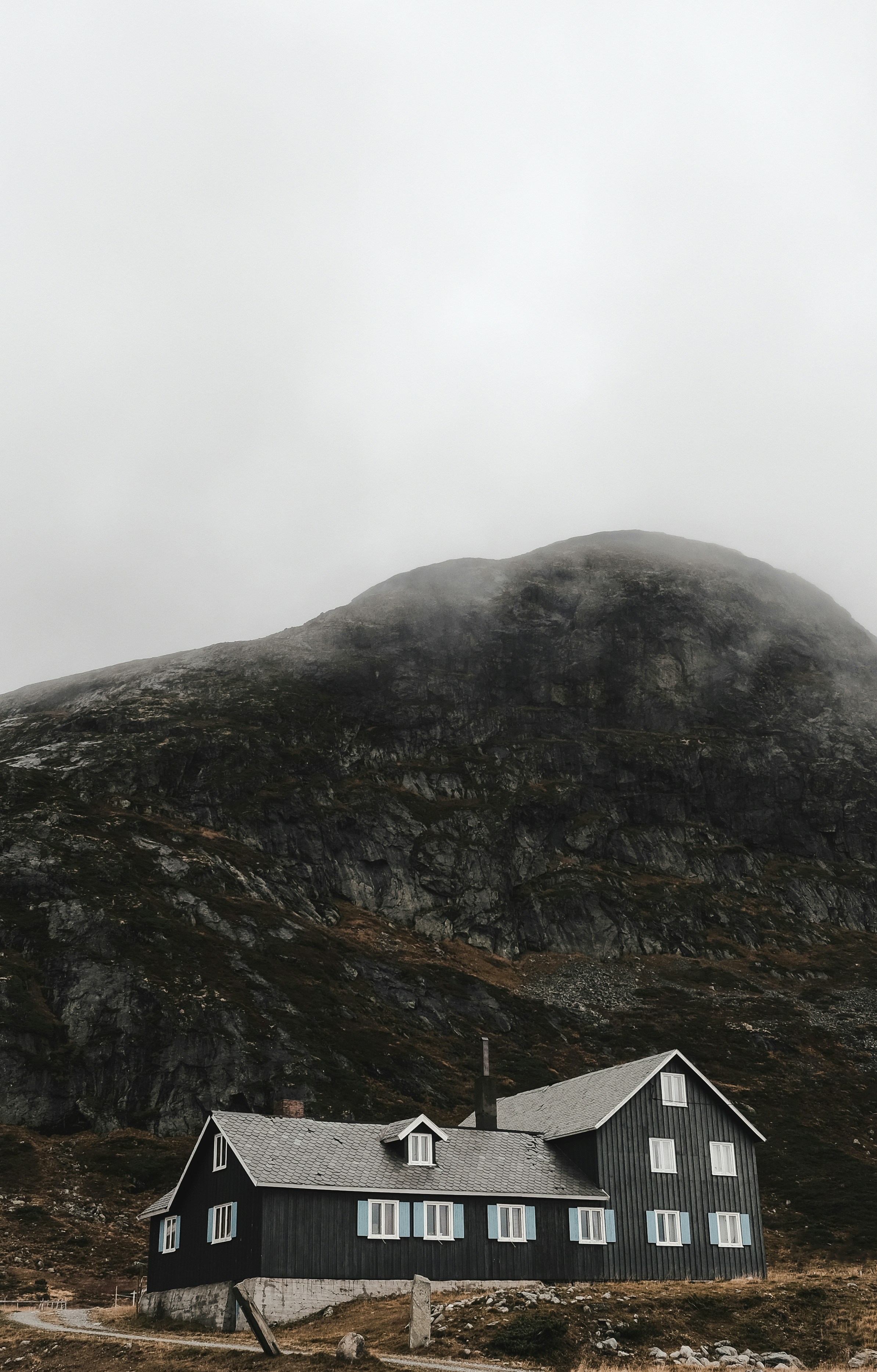 a house in front of a mountain