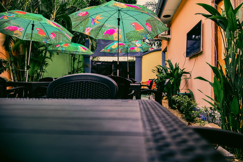 a table with chairs and umbrellas