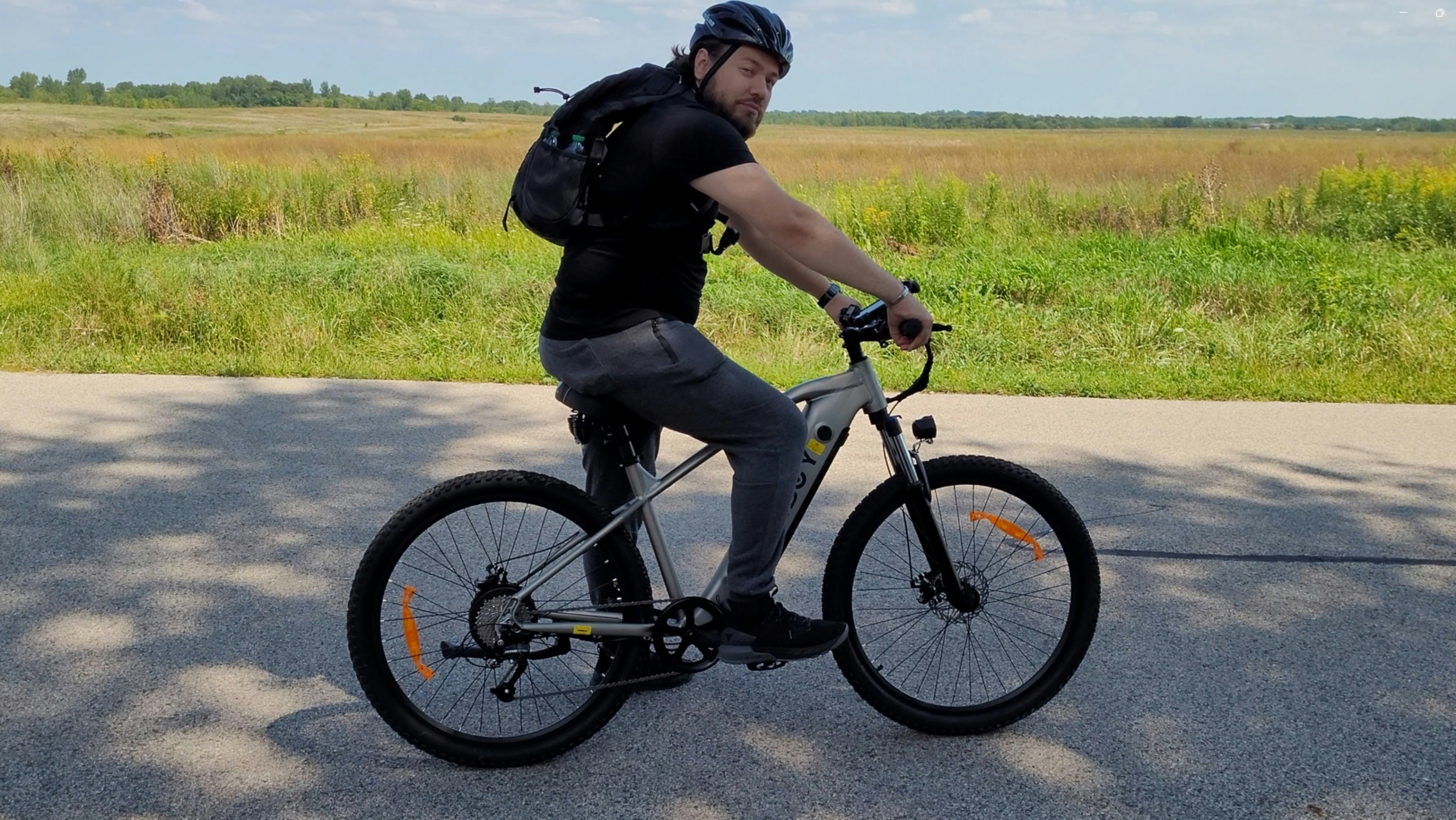 a man riding a bicycle on a road