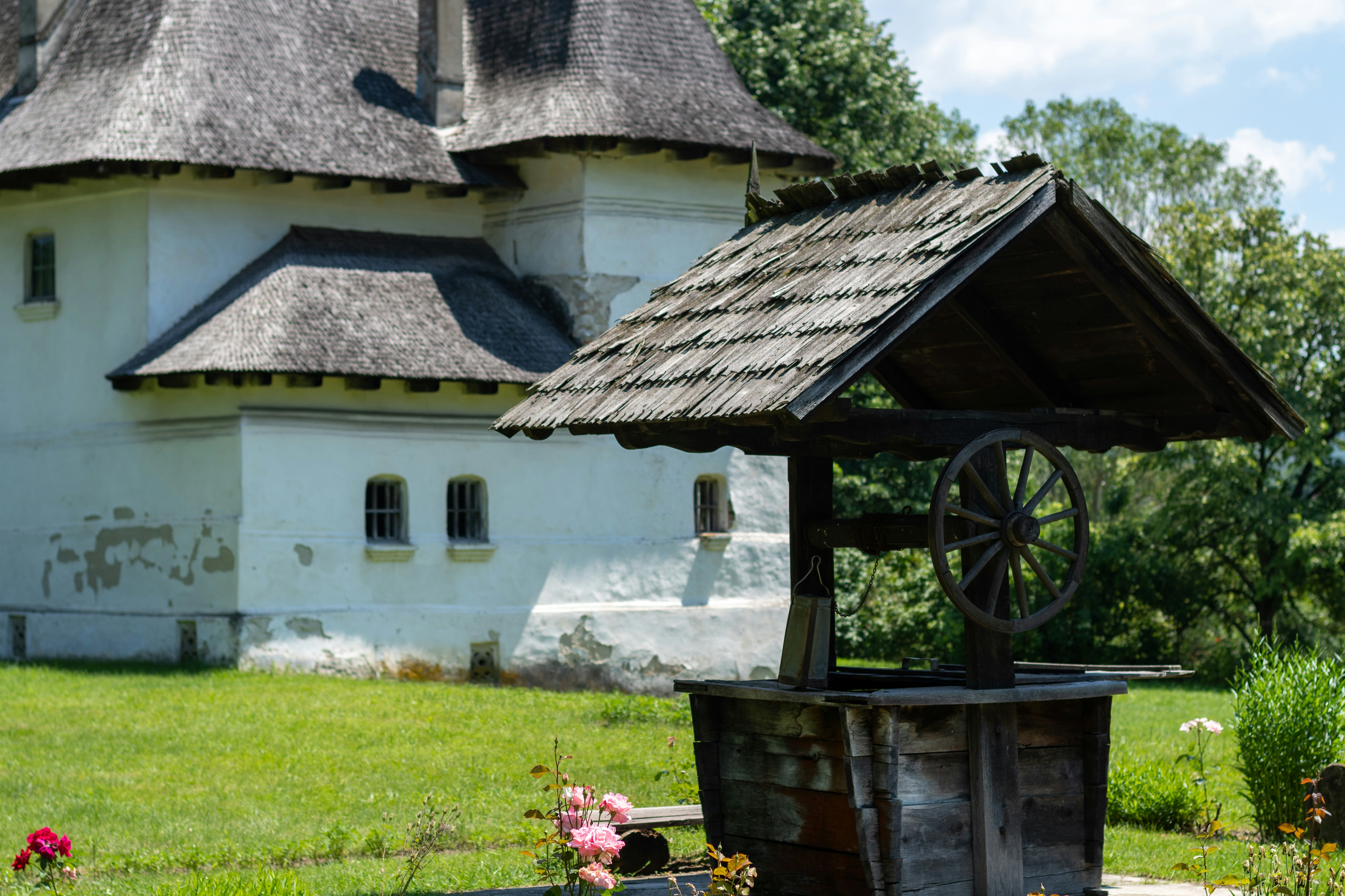 a white house with a wagon in front of it