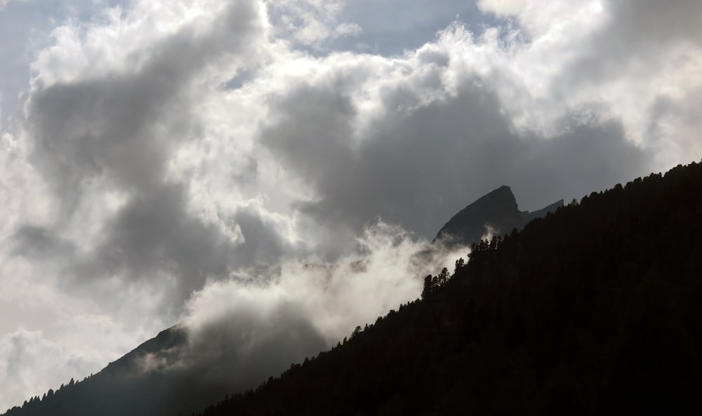 a mountain with clouds