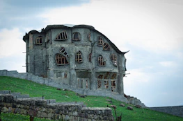 a stone building with a stone wall
