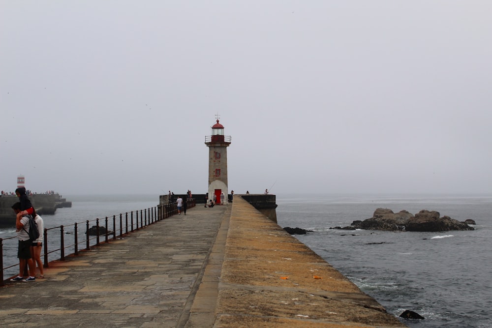 a lighthouse on a pier