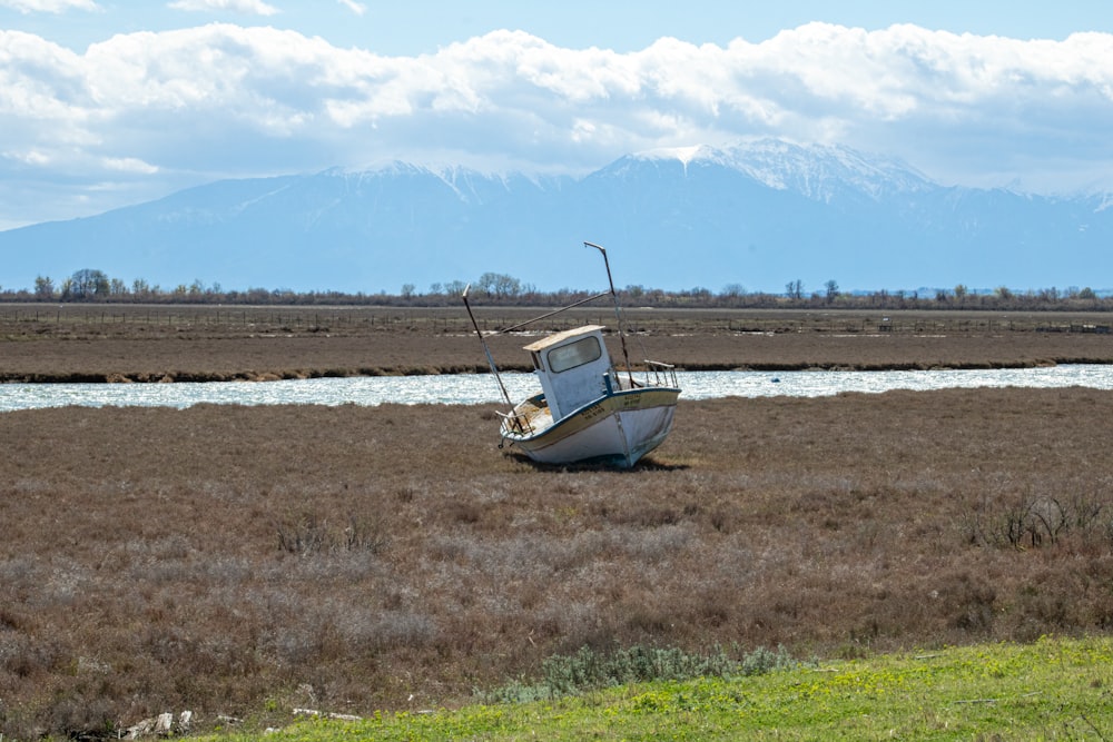 a boat sits in a field