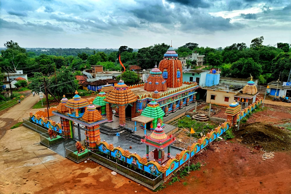 a colorful playground with trees and buildings