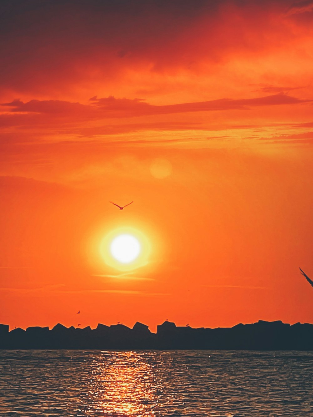 a sunset over a body of water