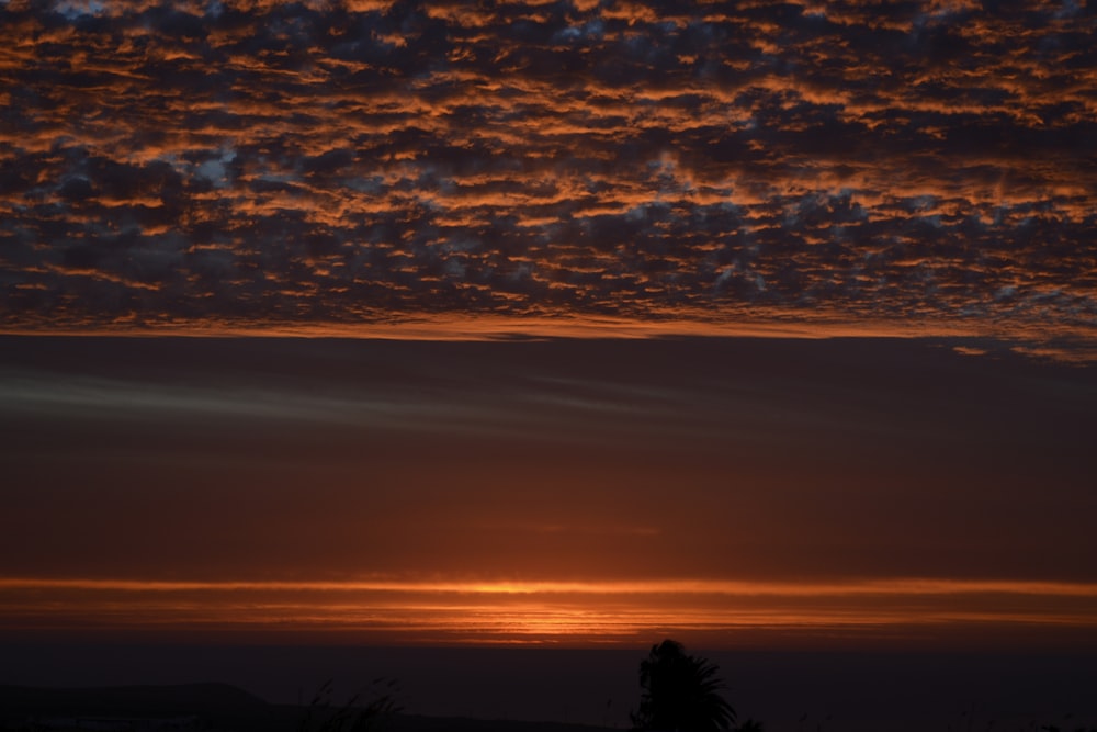 a sunset over a body of water