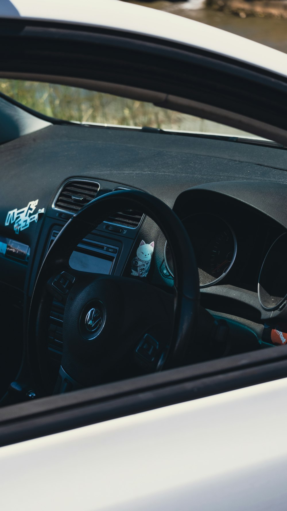 a car dashboard with a steering wheel