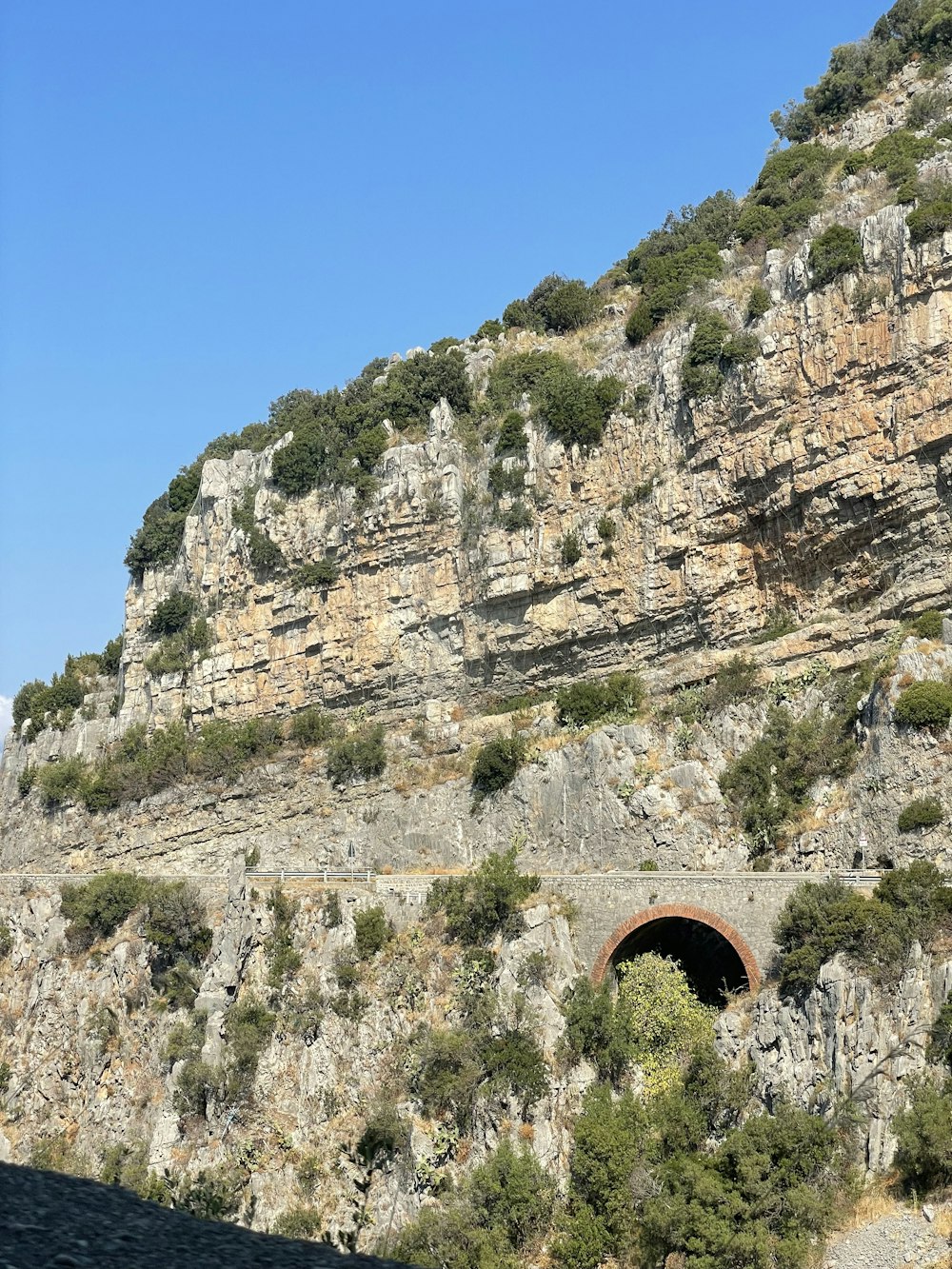 a stone bridge over a cliff