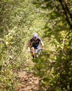 Close-up of a cyclist navigating a sharp turn on a mountain trail.