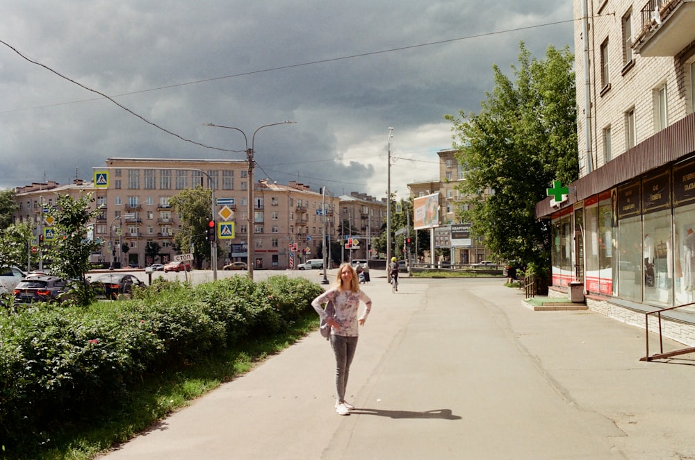 a person walking down a sidewalk