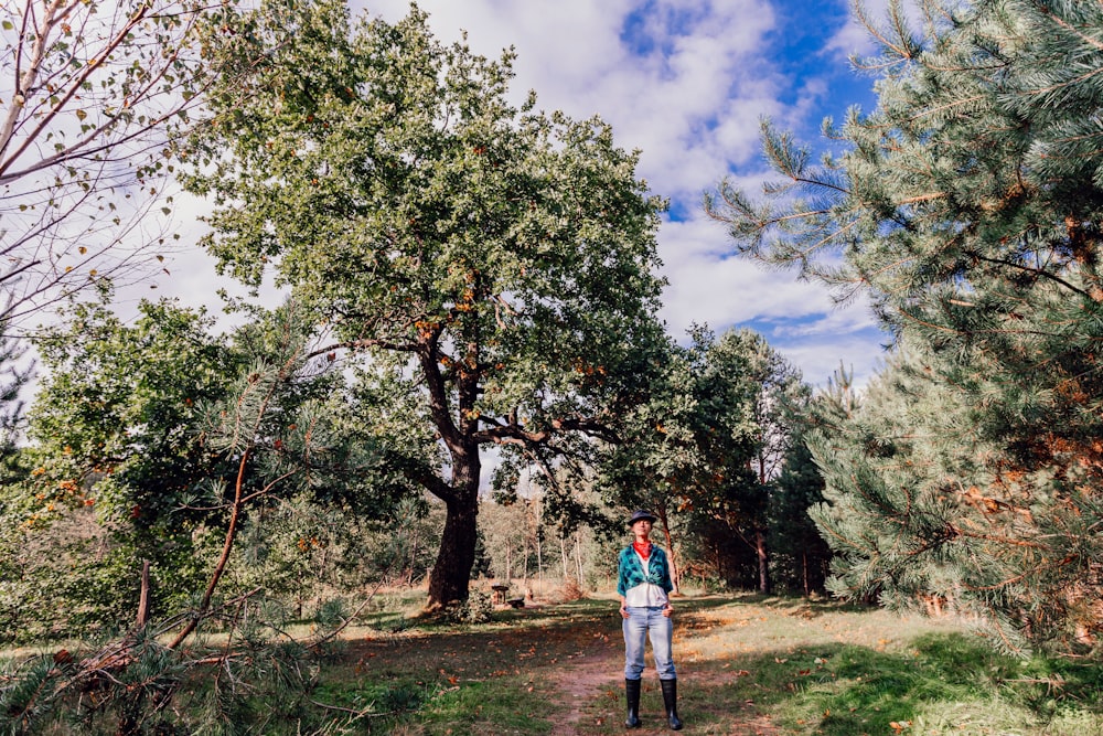 a person standing in a forest