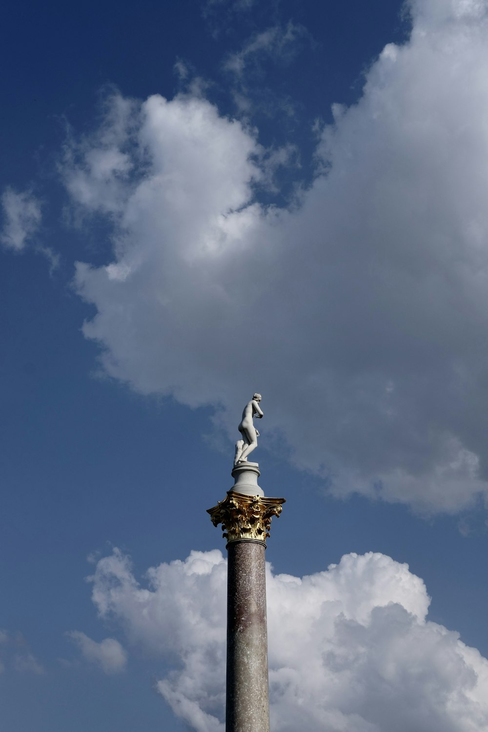 a statue on a pillar