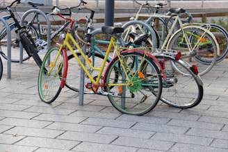 a group of bicycles parked on a sidewalk