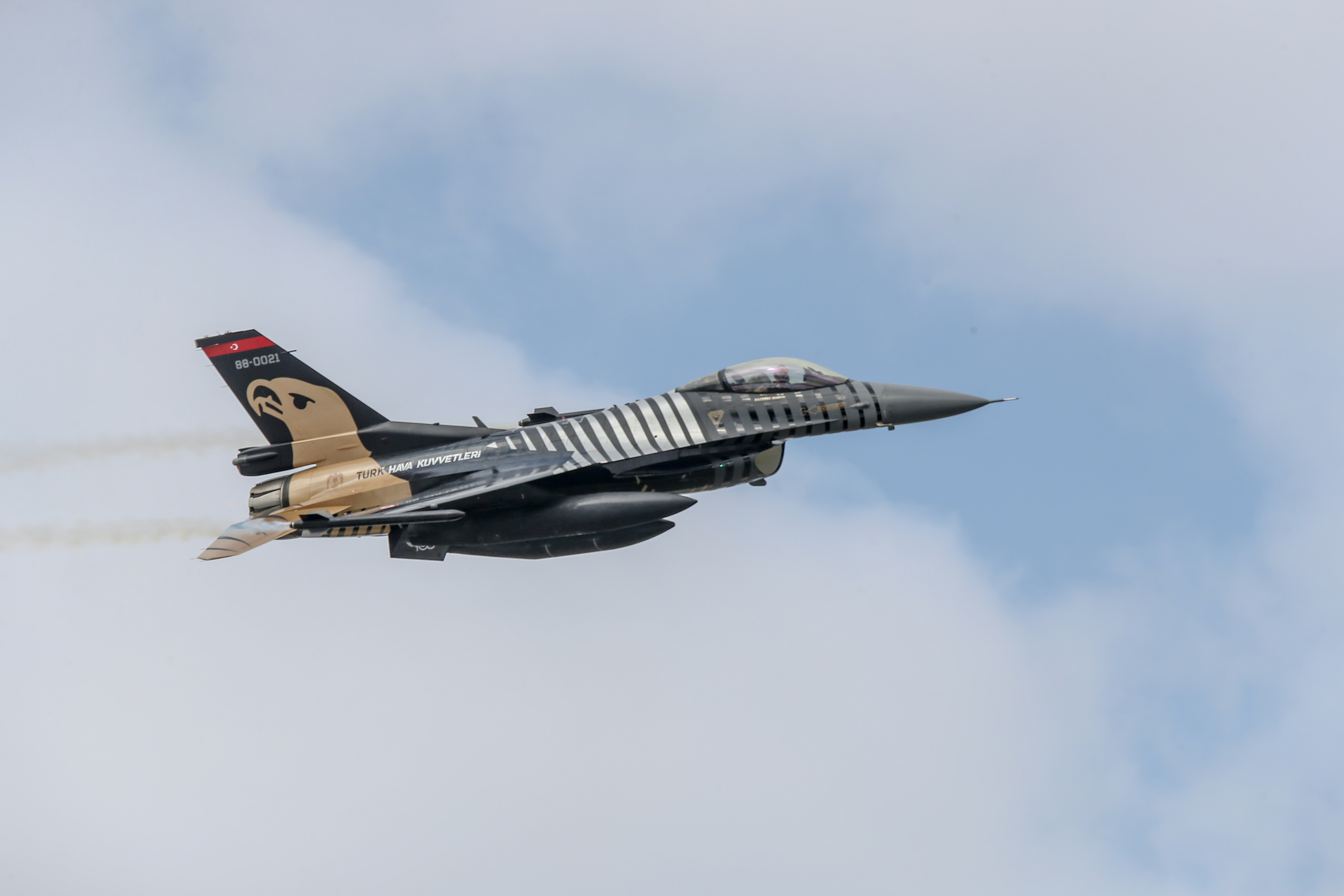 a fighter jet flying in the sky
