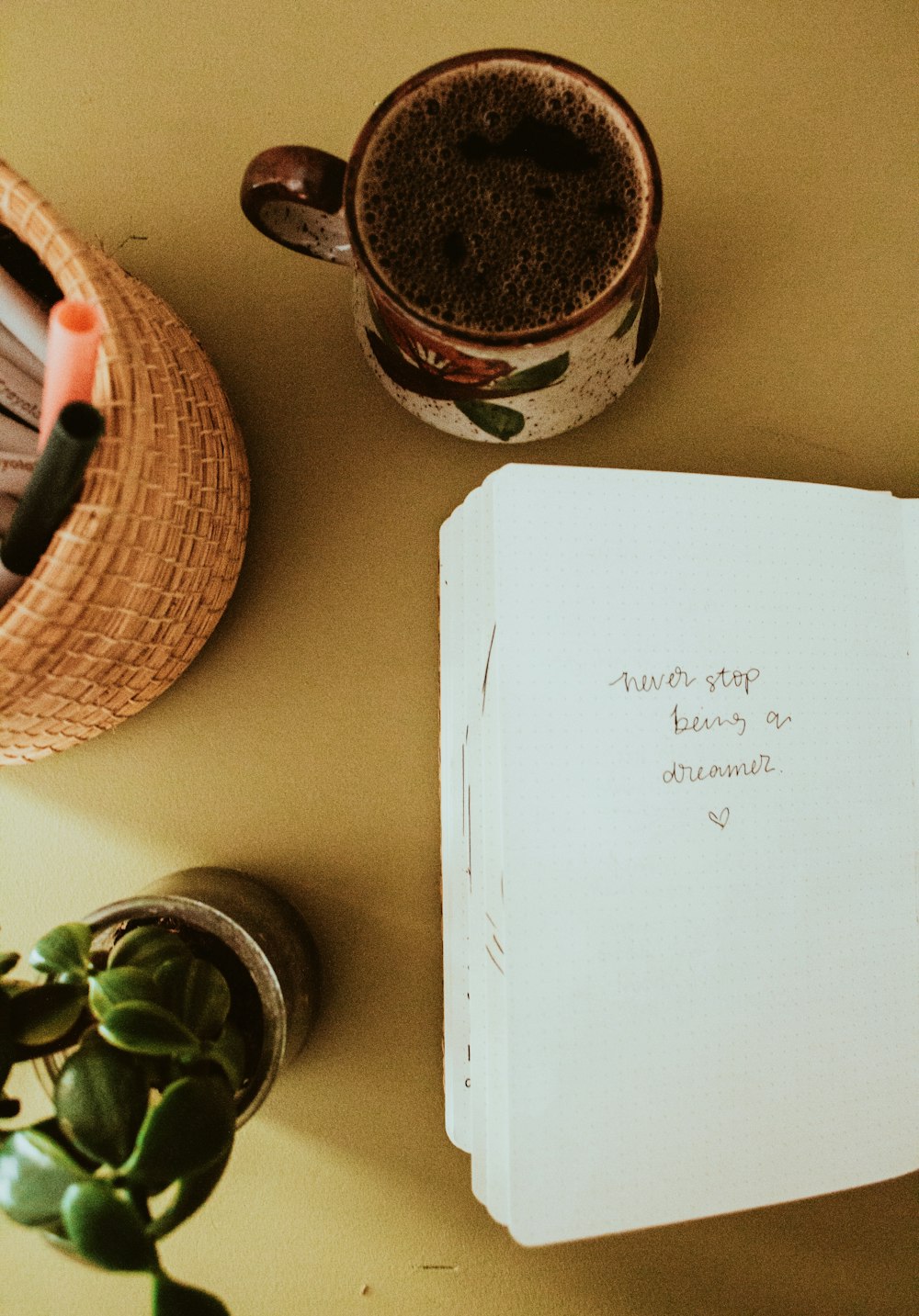 a paper and a pot on a table