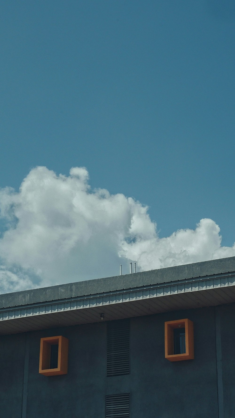 a house with a cloudy sky