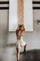 a woman holding a wooden pole