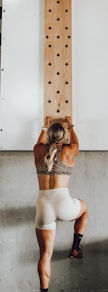 a woman holding a wooden pole