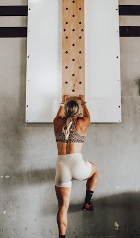 a woman holding a wooden pole