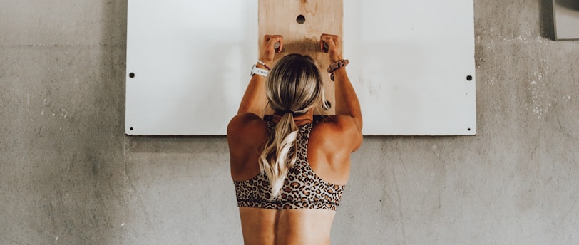 a woman holding a wooden pole