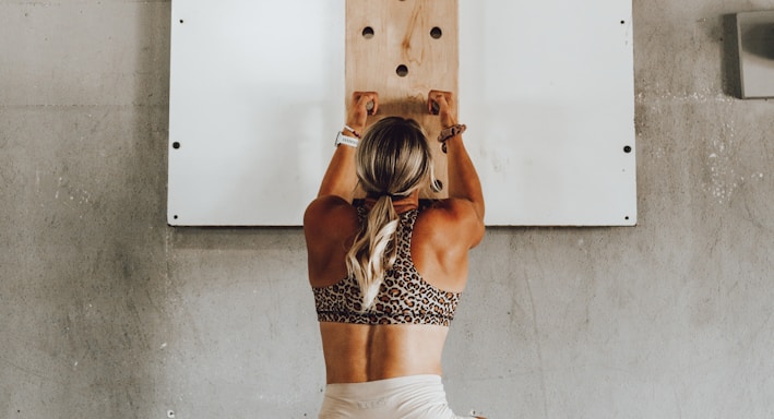 a woman holding a wooden pole