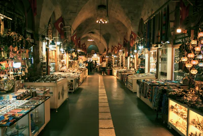 A lit arcade of shops in the Gaziantep bazaar