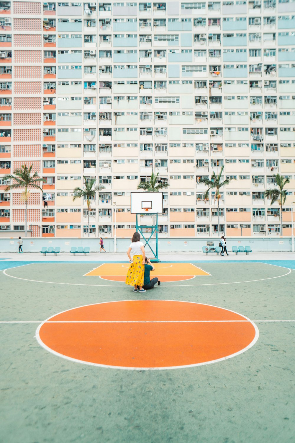 a person walking on a basketball court