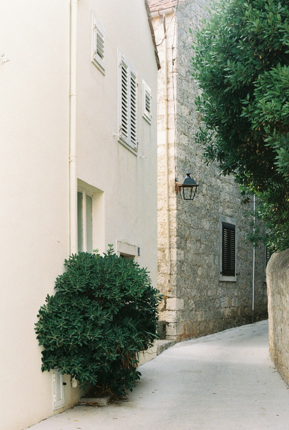 a white building with a light on the side