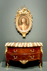 Before-and-after image showing a vintage dresser transformed with a rich, elegant finish.