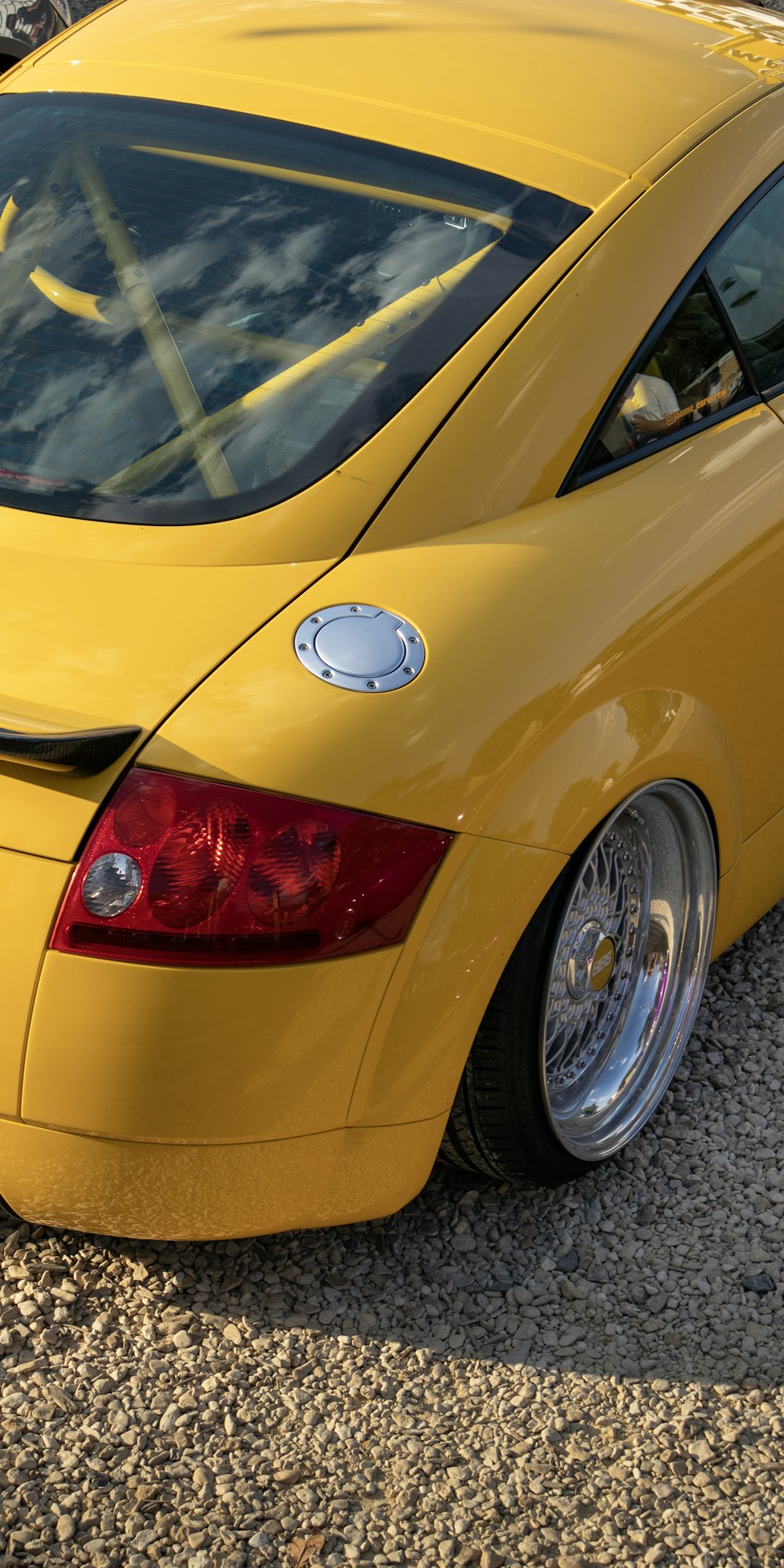 the back of a yellow car