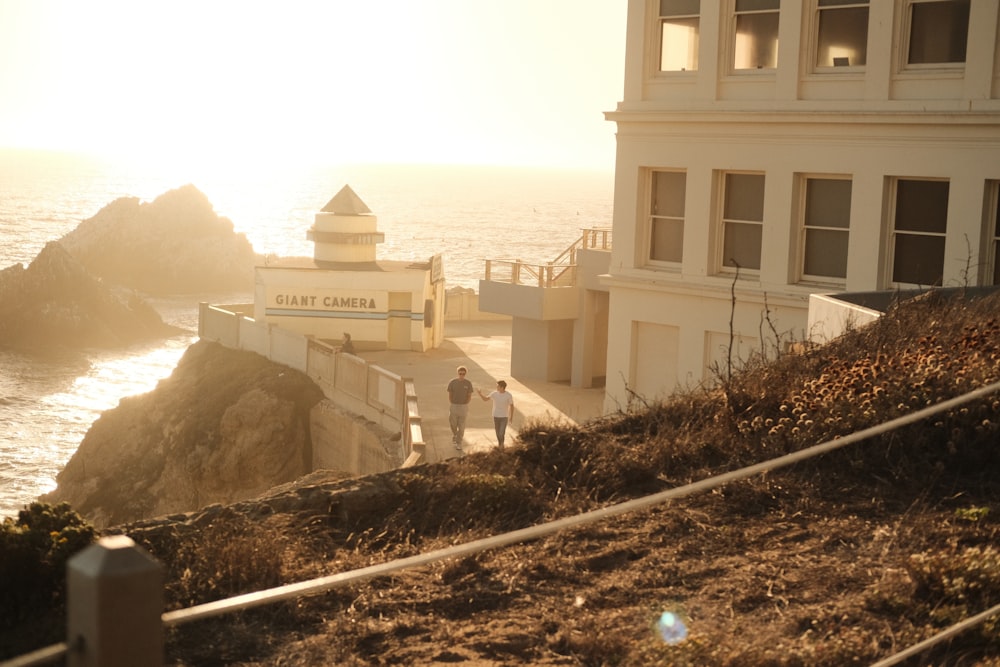 a building on a cliff by the water