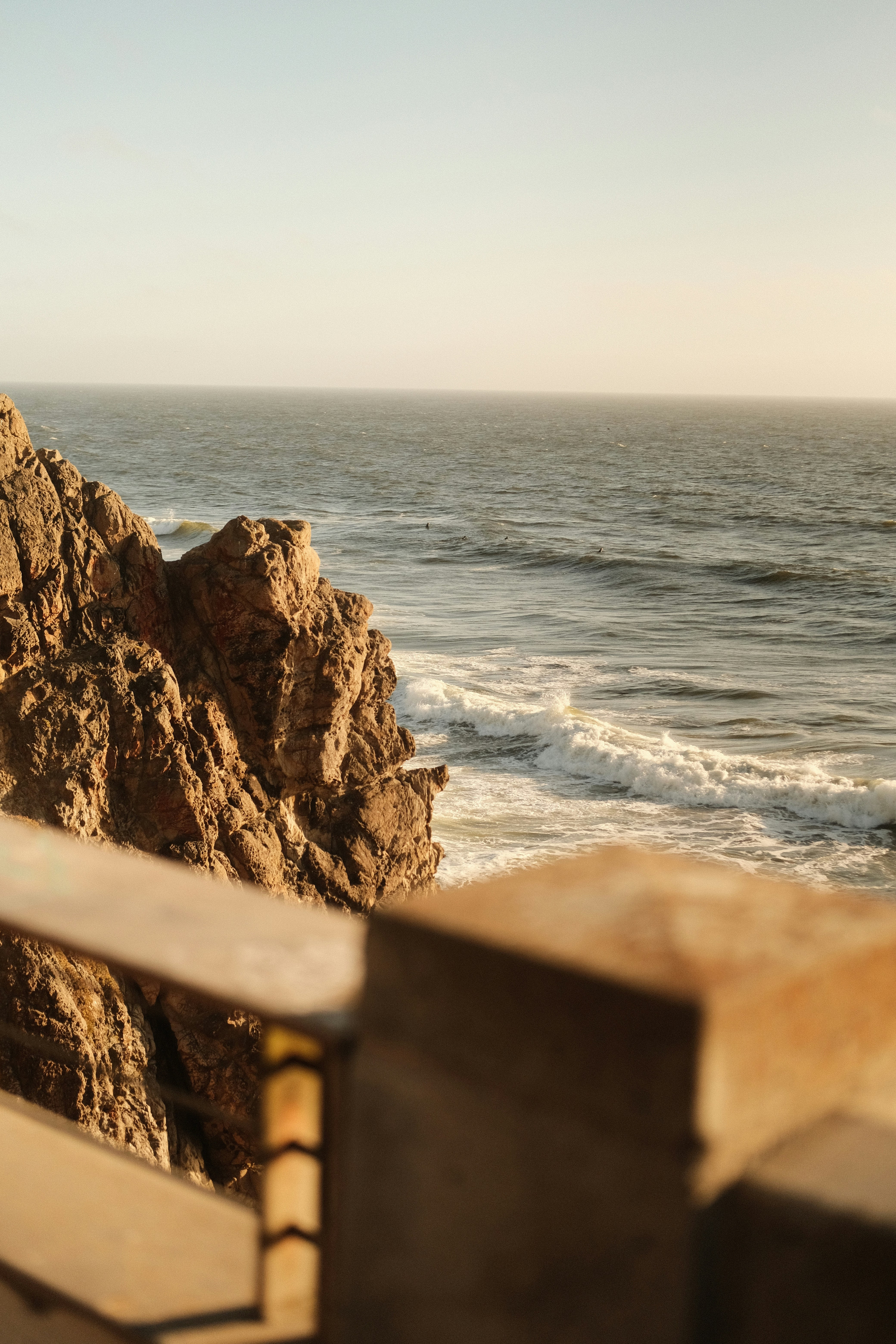a stone wall overlooking the ocean