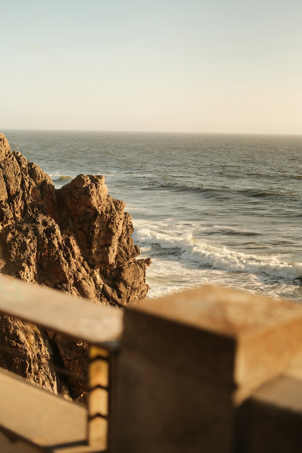 a stone wall overlooking the ocean