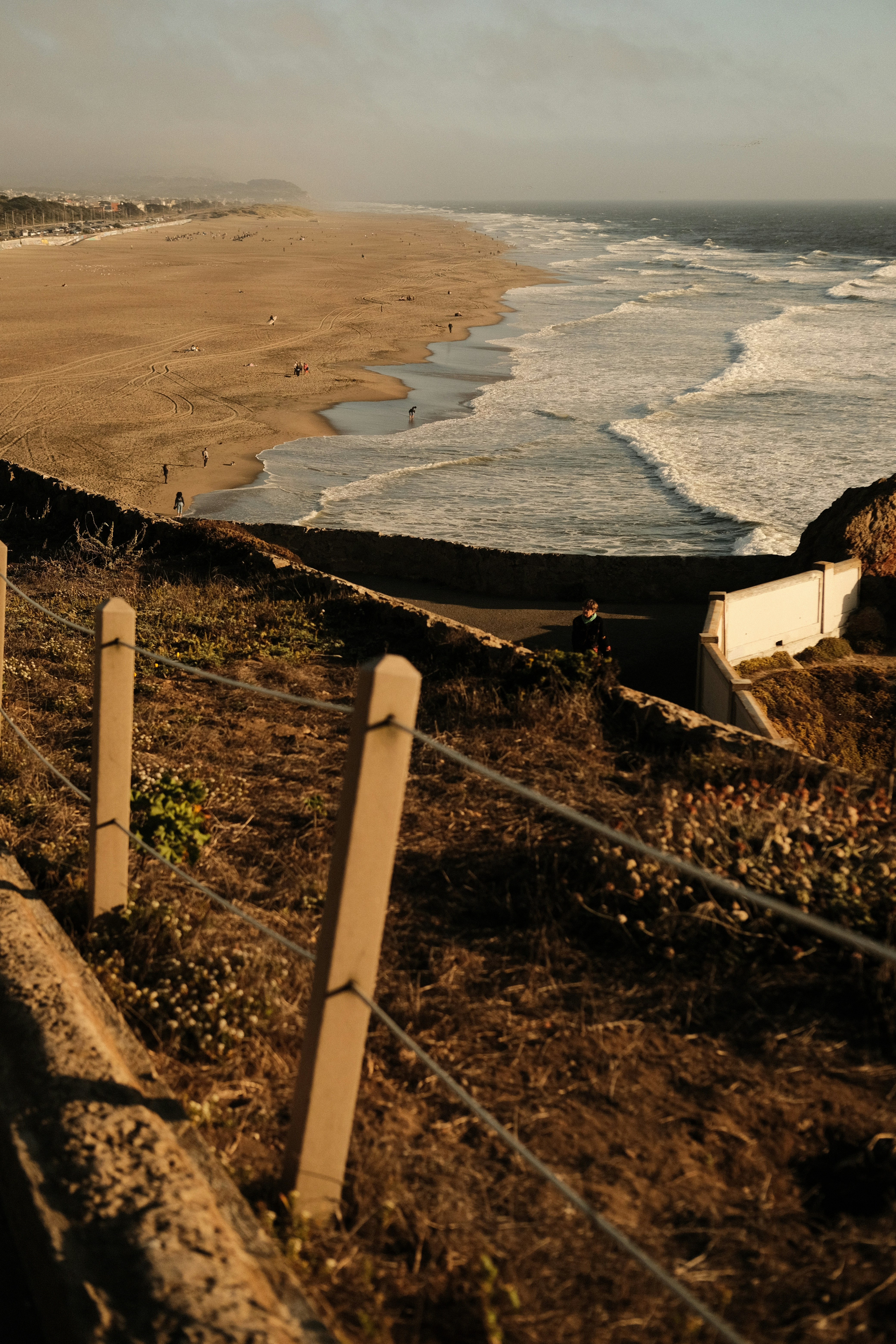 a large dam with a body of water in the background