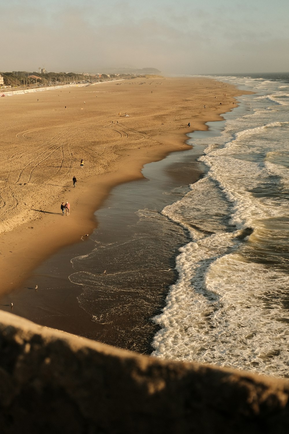 a beach with people on it