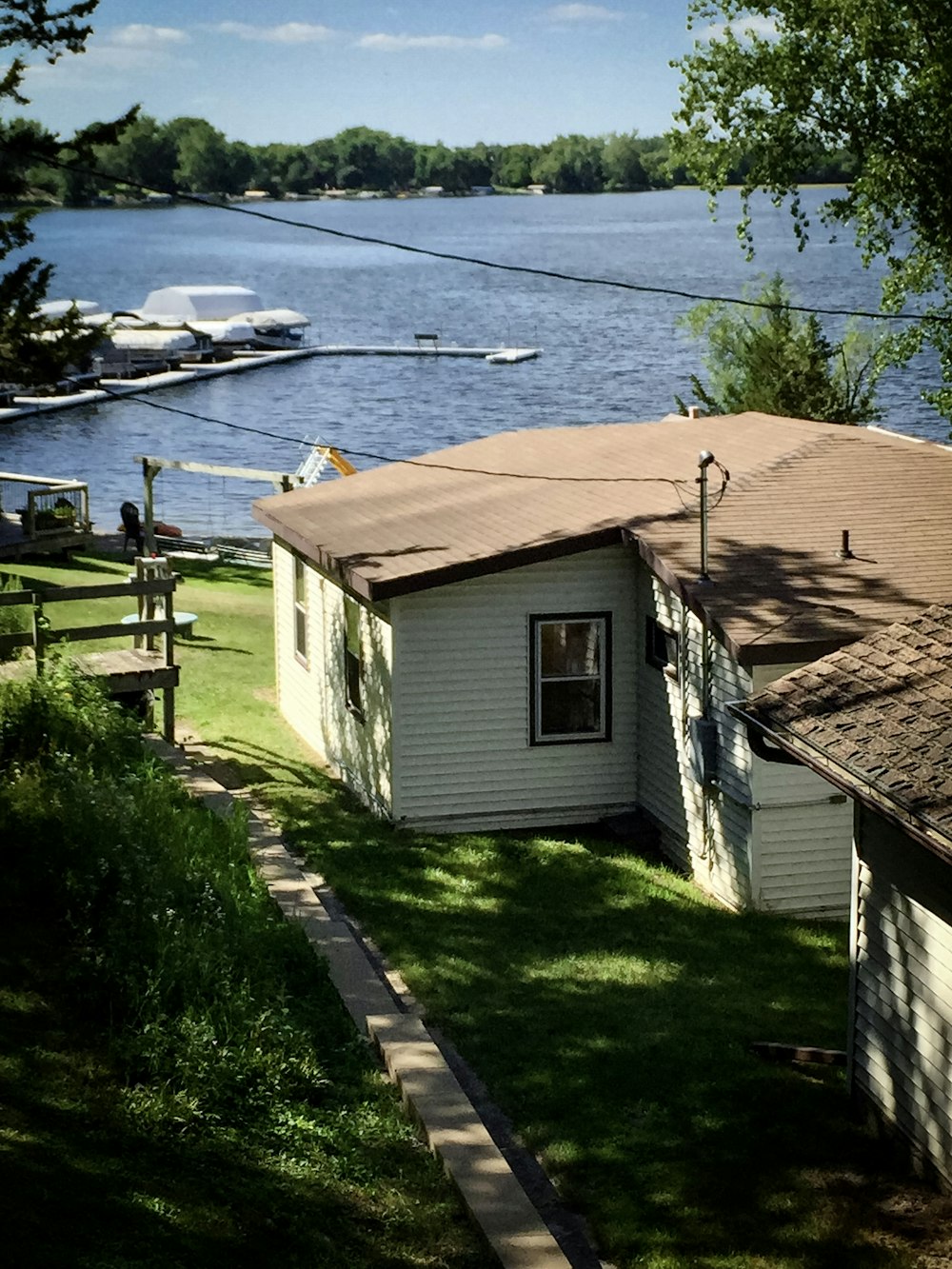 a house next to a body of water