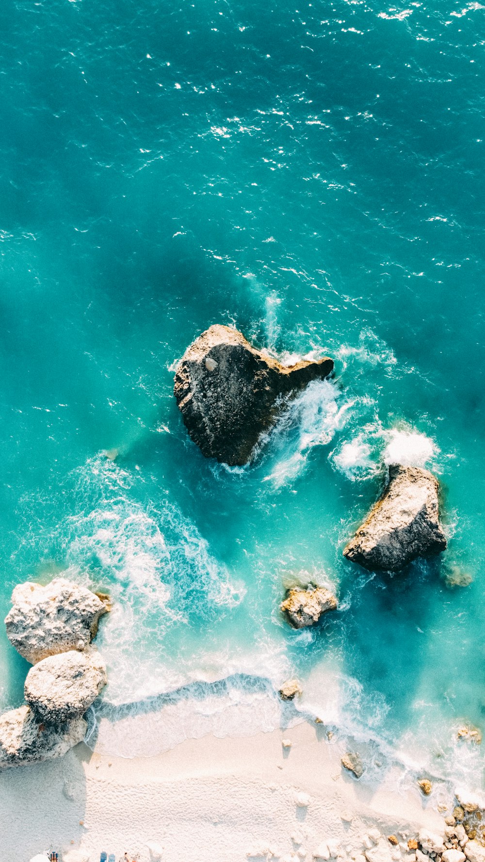 a group of rocks in the water