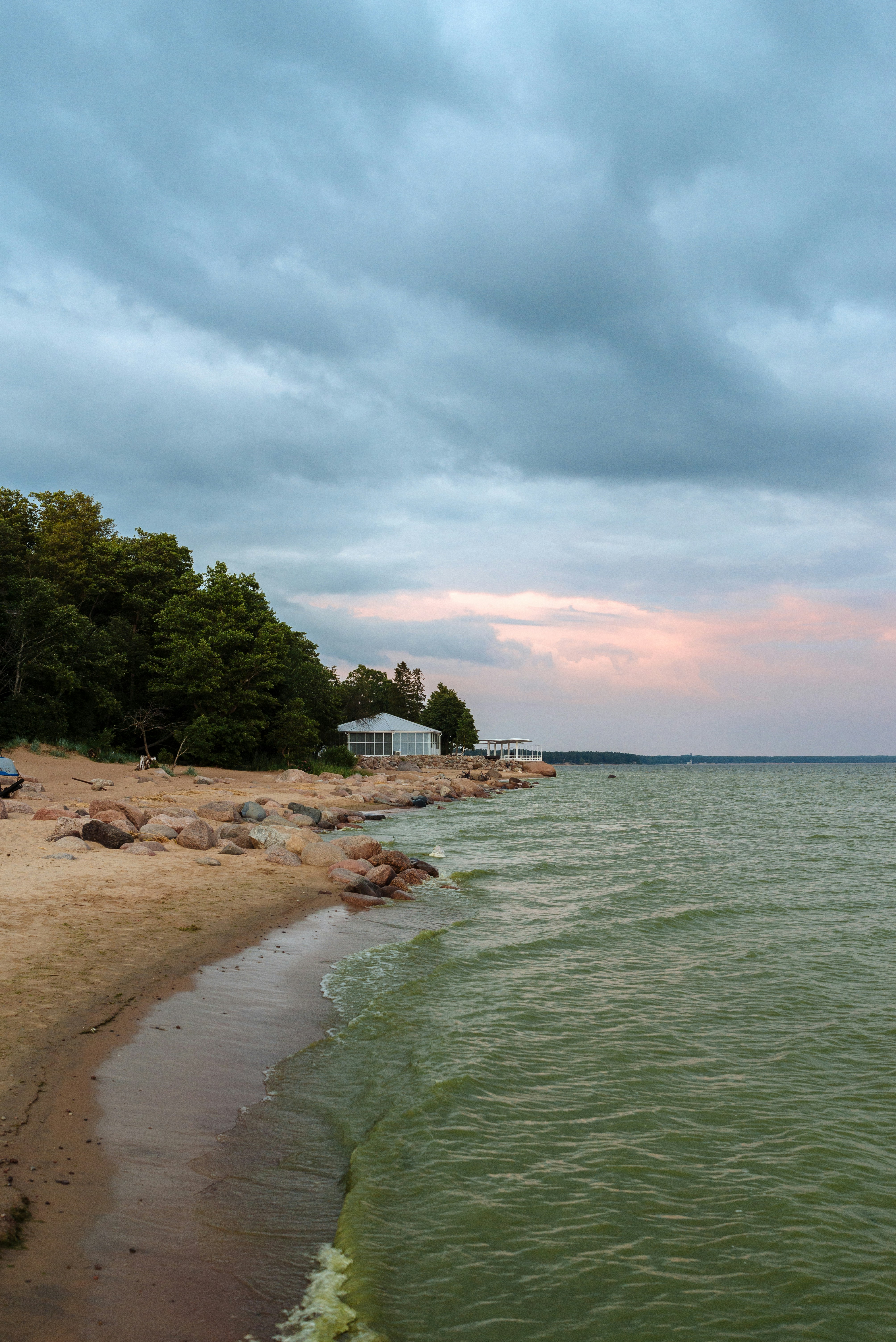 A beach with a building and trees photo – Free Репино Image on Unsplash