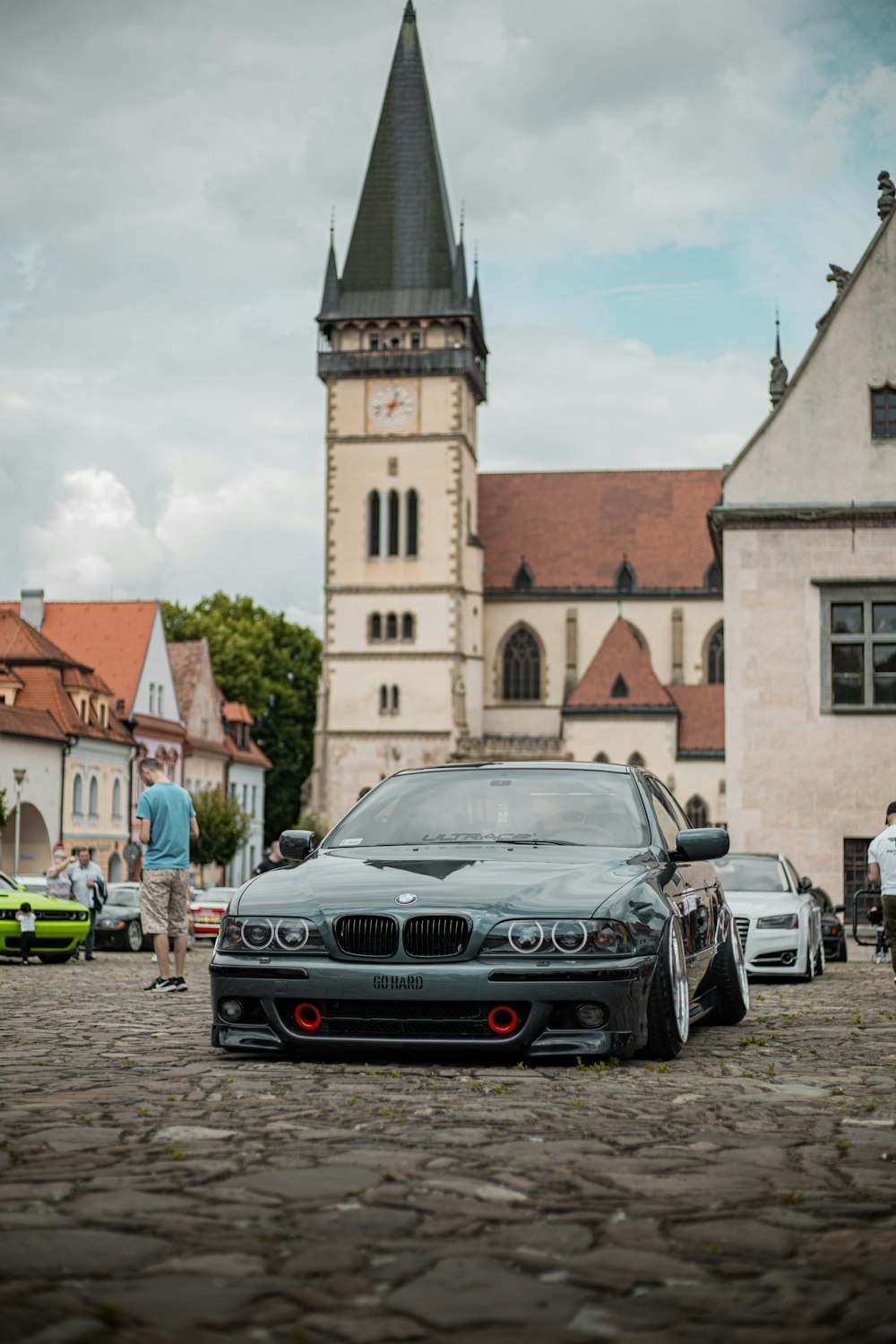 a group of cars parked in front of a church