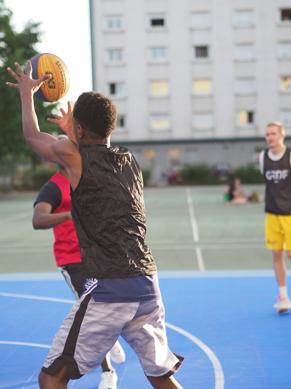 a man shooting a basketball